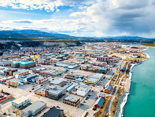 Worker preparing documents for immigration opportunities in Yukon