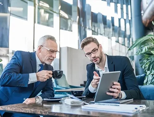 Business owner discussing Canadian immigration options during a strategy meeting